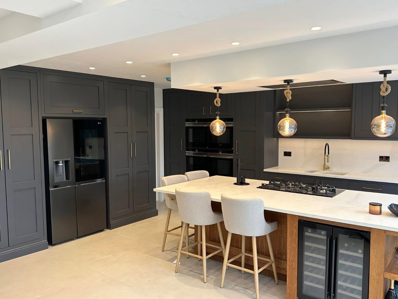 Luxury dark shaker kitchen with marble island built by Tonge Builders