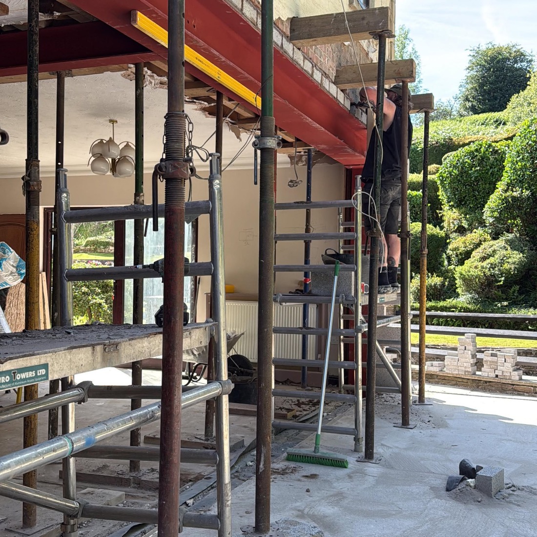 Structural steel beam installation with acrow props